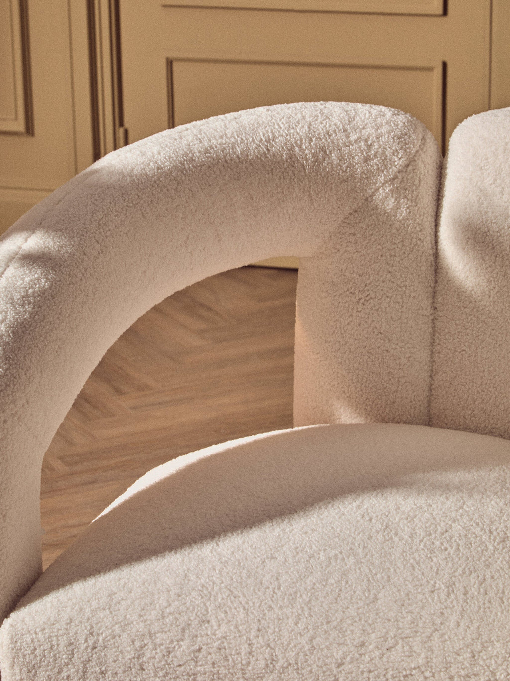 Diana Ivory Boucle Chair styled in contemporary living room as accent chair