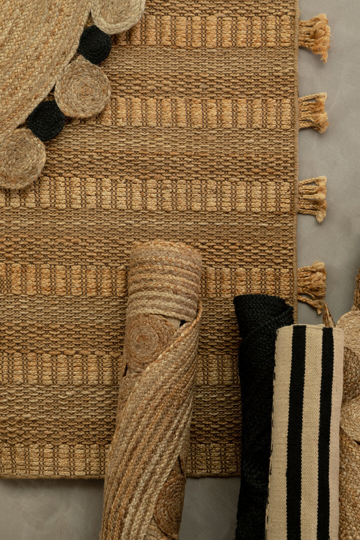 Nuvia Nexo Large Striped Rug weave variation detail showing handmade character