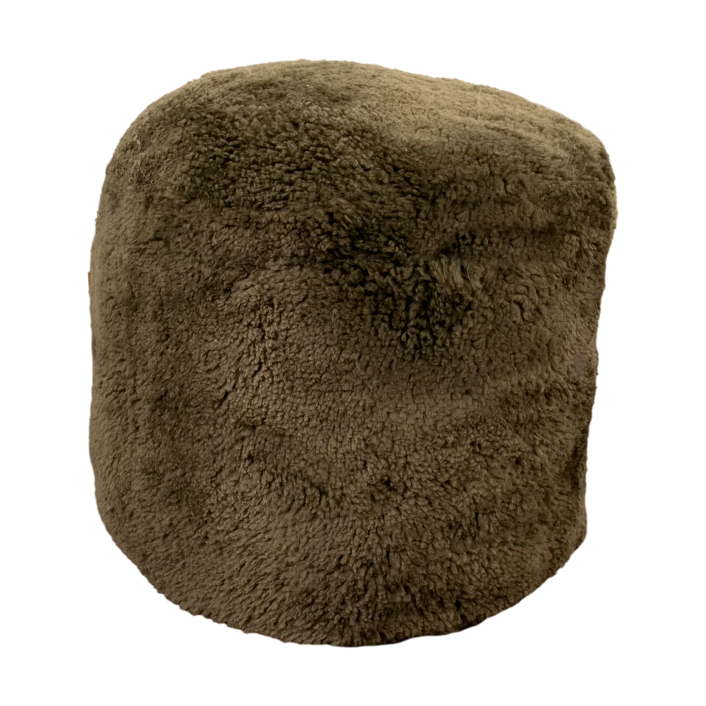Short Pile Sheepskin Khaki Green Footstool Pouffe styled in bohemian living room