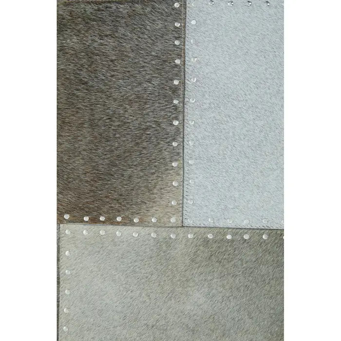 Vale Safira Grey Cowhide Patchwork Rug styled in living room under sofa